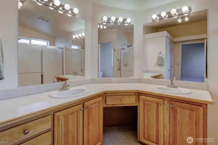 Double vanity, sprawling counter space, and abundant storage found in the primary ensuite!