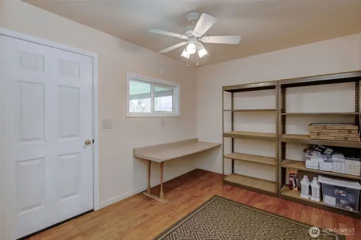 Inside the fully-finished hobby room, which connects to both the garage and covered patio.