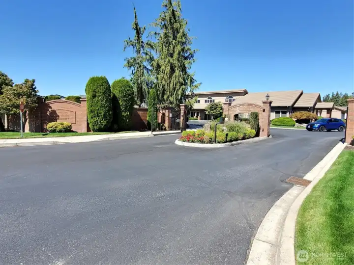 Sunrise East makes a statement with brick signage and wrought-iron gates!