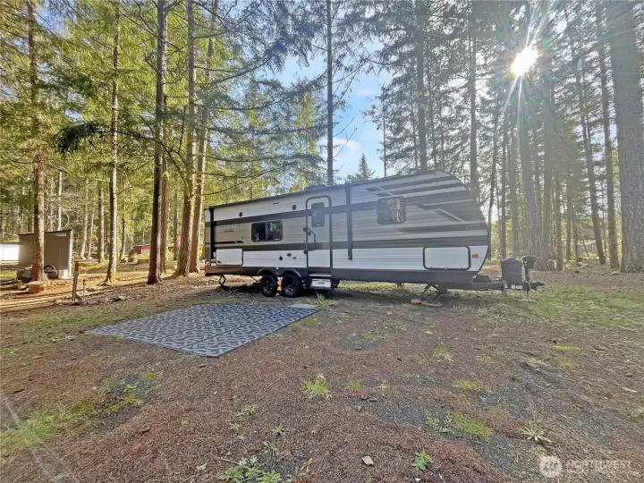 2021 Transcend Bunkhouse Trailer available for purchase separately. Sunrise filtered through the trees, included.