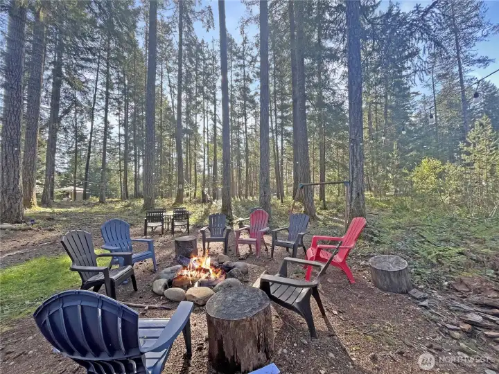 Enjoy the firepit setting with two adjacent lots in the background—each available for purchase separately. Enjoy the firepit setting with two adjacent lots in the background—each available for purchase separately.