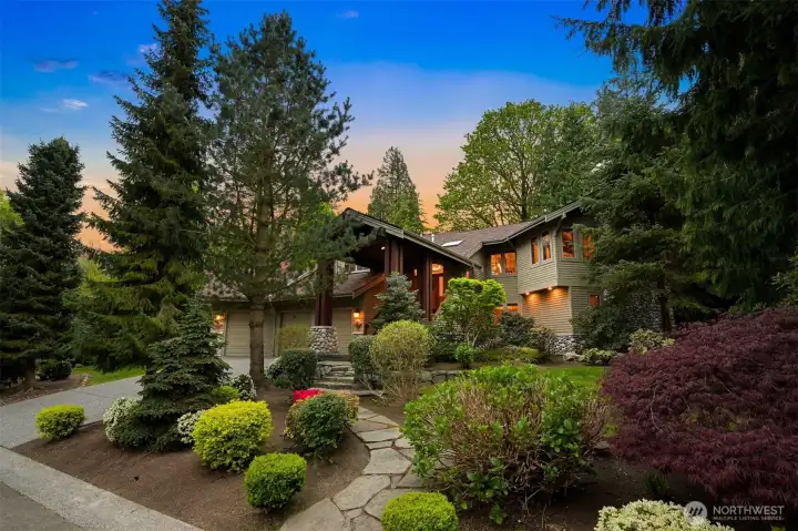 Beautifully landscaped grounds enhance the home’s outdoor appeal.