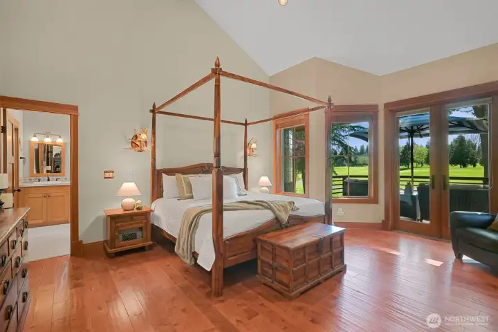The primary suite is a luxurious retreat with private access to the deck.