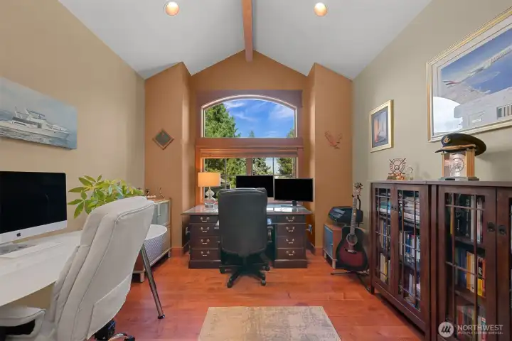 A spacious office on the main floor offers a quiet workspace.