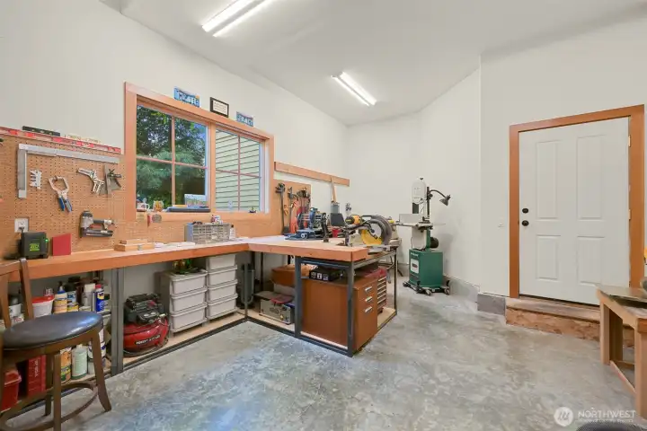 Heated workshop space offers functionality for hobbies or projects.