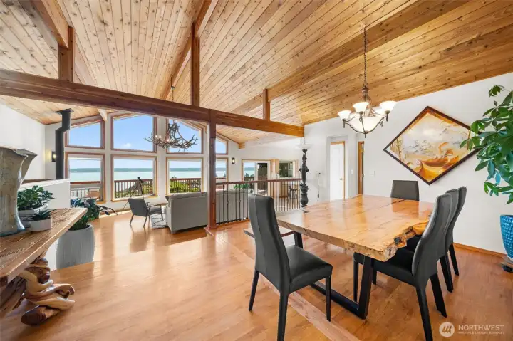 Vaulted cedar ceilings, exposed beams, and walls of windows frame breathtaking views of Puget Sound, Port Susan, Mt. Baker, and the Cascade Mountains from throughout the main floor.
