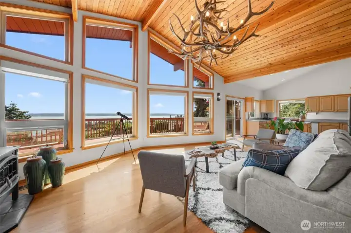 Walls of windows showcase breathtaking views, while the spectacular great room is filled with natural light