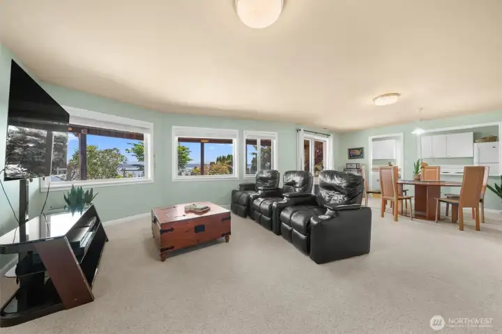 Spacious lower-level living area with a second kitchen, abundant natural light, and flexible space for guests, multigenerational living, or entertaining.