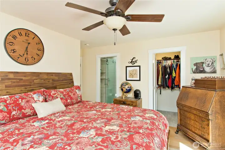 Primary bedroom with walk-in closet and upgraded primary bath! Also includes a convenient sliding door to your outdoor deck and hot tub!