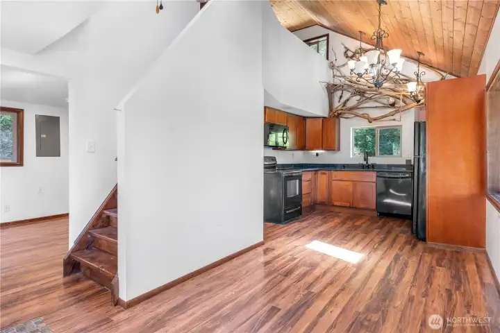 Dining room into kitchen and living area to the left. Dining room into kitchen and living area to the left.