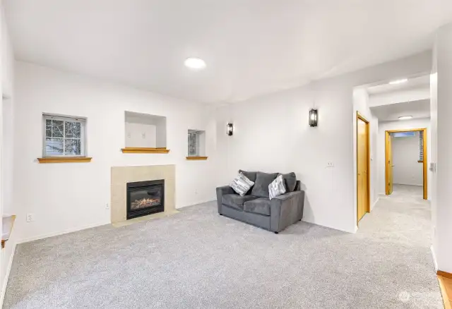 Living room with hallway to bedrooms and bathroom on the right