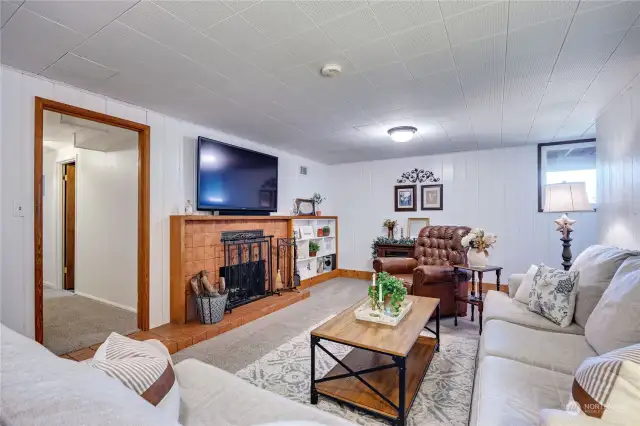 Lower level features a second family room, this one features a wood burning fireplace, new pad/carpet and fresh paint.