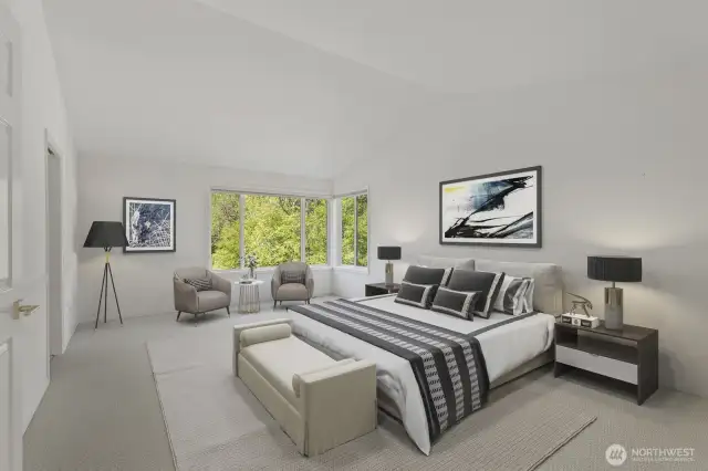 Double doors lead to the primary suite featuring a tall vaulted ceiling, 2 walk-in closets and updated 5-piece bathroom. (virtually staged)