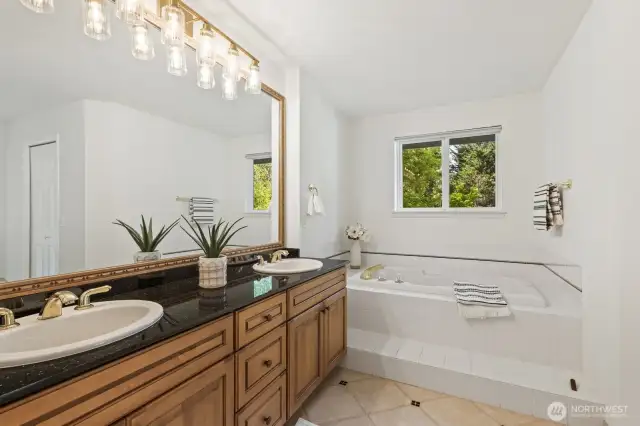 Tiled floor, 2 walk-in closets and large soaking tub in the primary bathroom.