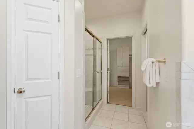 Linen closet, separate toilet room and tiled shower.