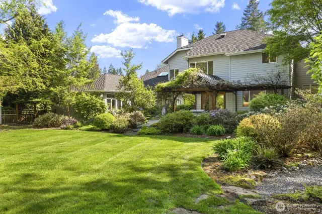The .84 acre lot enjoys a west facing, fully fenced backyard backing to the trail.