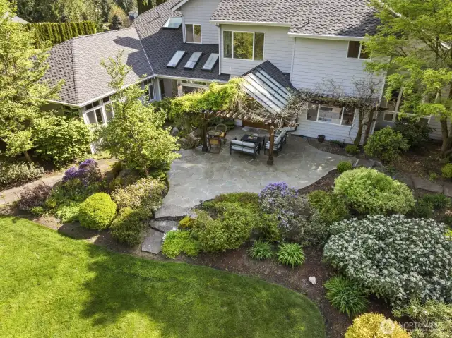The grounds are a lovely blend of manicured gardens dotted with tall evergreens.
