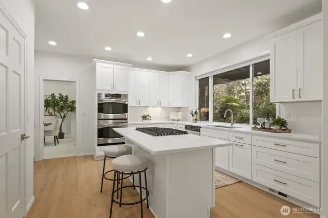 Breakfast bar with seating and walk-in pantry.
