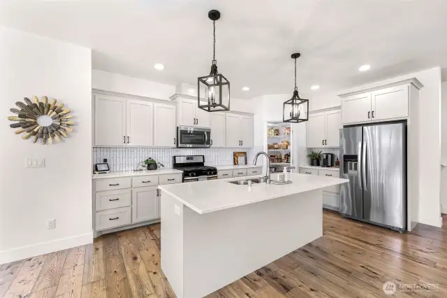 Kitchen with plenty of cooking and baking space on quartz counters