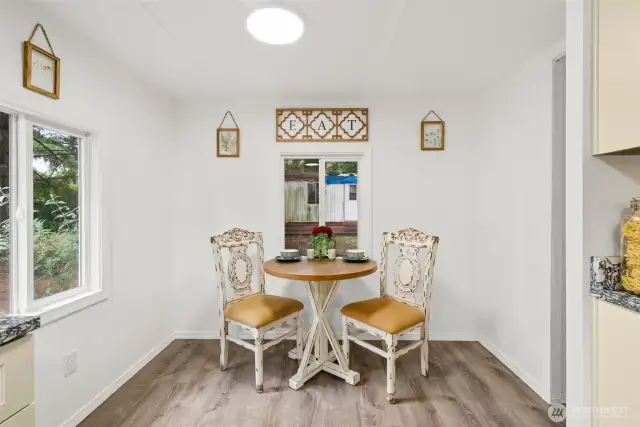 Cozy eating nook and pantry for storage.