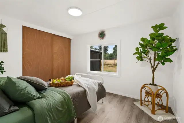 Primary bedroom looking out to backyard.