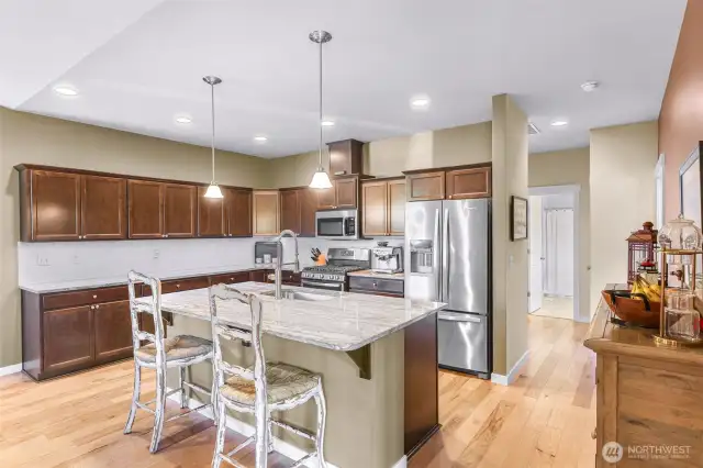 View of kitchen from sunroom just off kitchen, easy access for full entertaining!