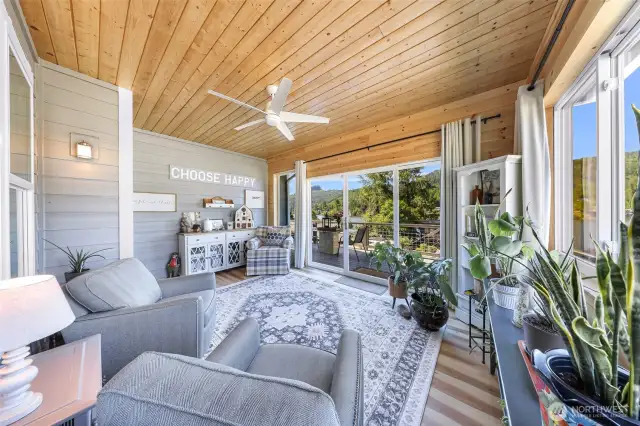 Converted outdoor space into indoor space created a beautiful sunroom located just off the main level living space, with gorgeous lake views to enjoy all year around.