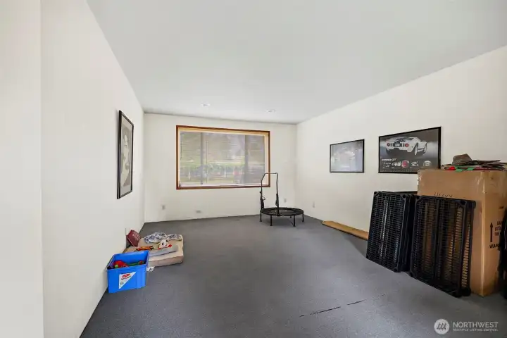 Another view of this huge Great room!  Kids playroom, workout studio, the possibilities are endless!