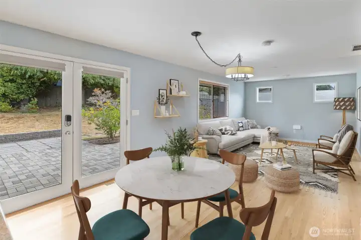 French doors lead to paved patio for indoor-outdoor entertaining.