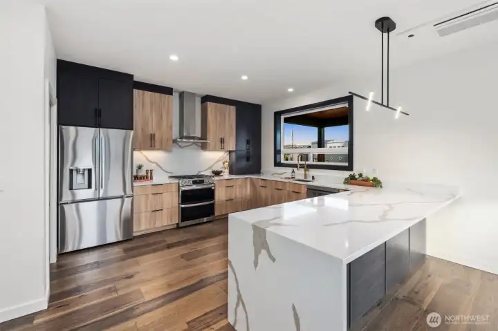 Gourmet kitchen boasting custom cabinetry...