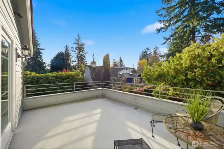 Private deck off primary bedroom with view of custom built shed