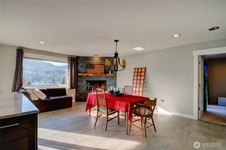 Dining area has wood fireplace.