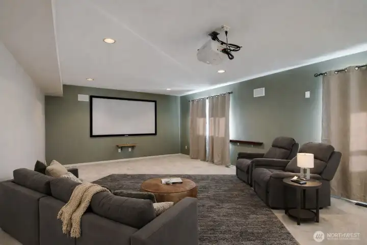 Media room with projector TV- great spot to chill! (Virtually Staged Image)