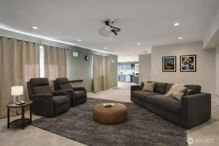 Rec room opens to media room. (Virtually Staged Image)