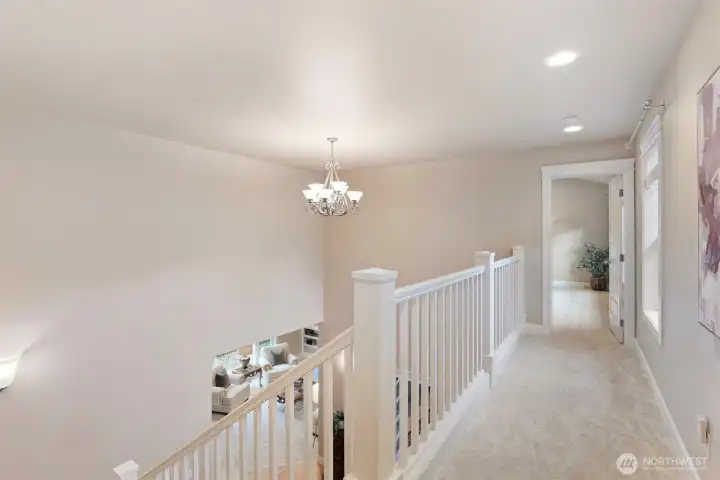 Long hall separates primary from other 3 bedrooms