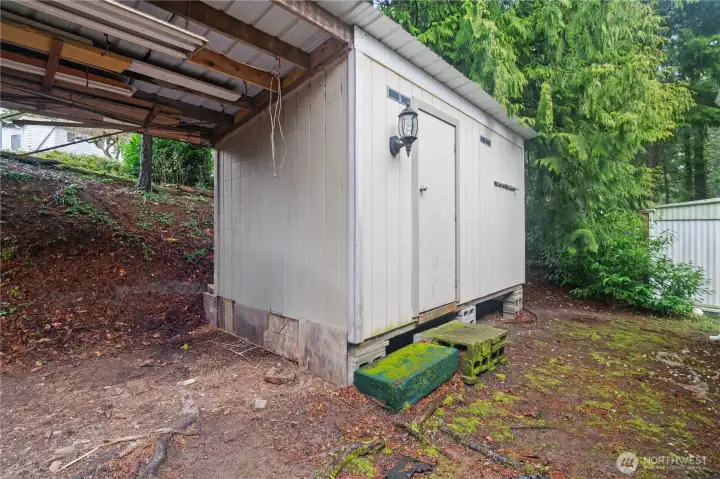 Handy storage shed for tools and extra belongings.