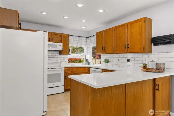 Kitchen with updated quartz countertops and soft-close cabinetry