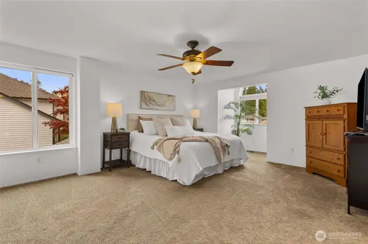Spacious primary bedroom with en suite bath and large walk-in closet