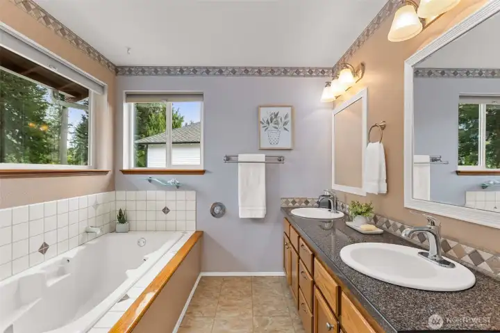 Large primary en suite bath with private shower and toilet