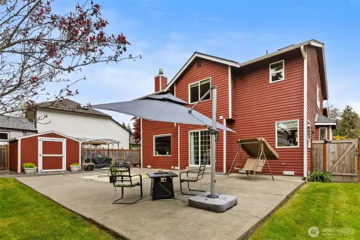 Level, fully fenced backyard