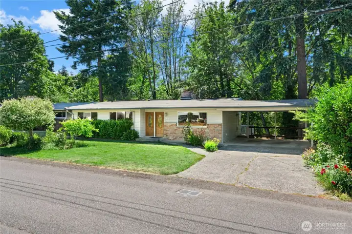 Classic mid-century home offering spacious living, a massive workshop, and a private backyard retreat. Classic mid-century home offering spacious living, a massive workshop, and a private backyard retreat.