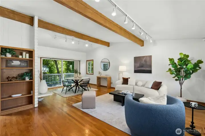 Vaulted ceilings and exposed beams create a warm, open living space. Vaulted ceilings and exposed beams create a warm, open living space.