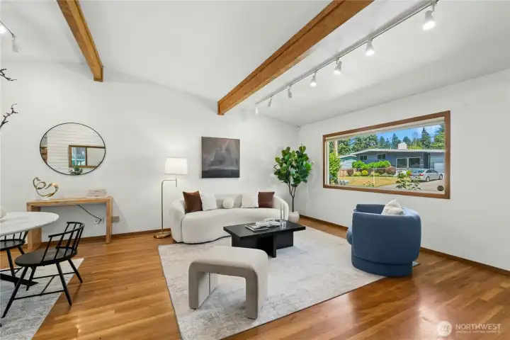 Spacious living room filled with natural light and architectural character. Spacious living room filled with natural light and architectural character.