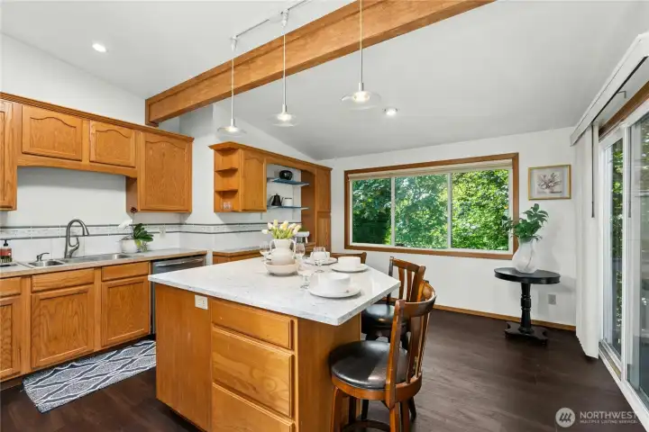 Generous kitchen with abundant cabinetry and backyard views. Generous kitchen with abundant cabinetry and backyard views.