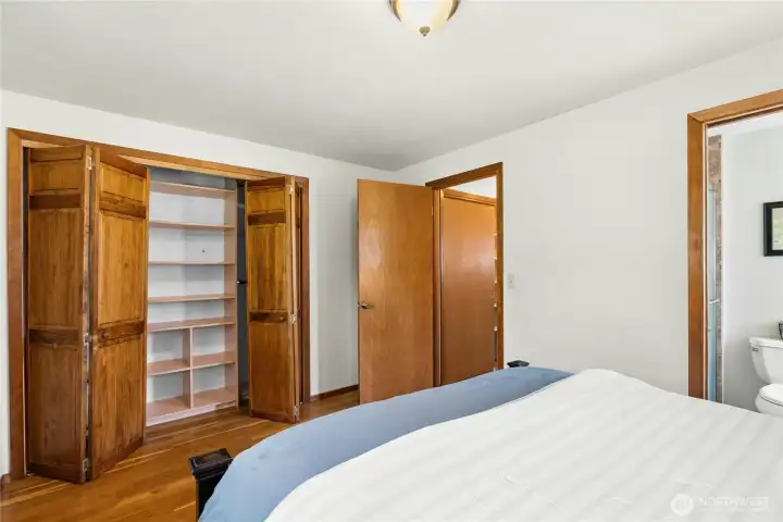 Primary suite featuring generous closet space and built-in organization. Primary suite featuring generous closet space and built-in organization.