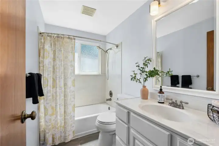 Full bathroom with extended vanity and abundant storage. Full bathroom with extended vanity and abundant storage.