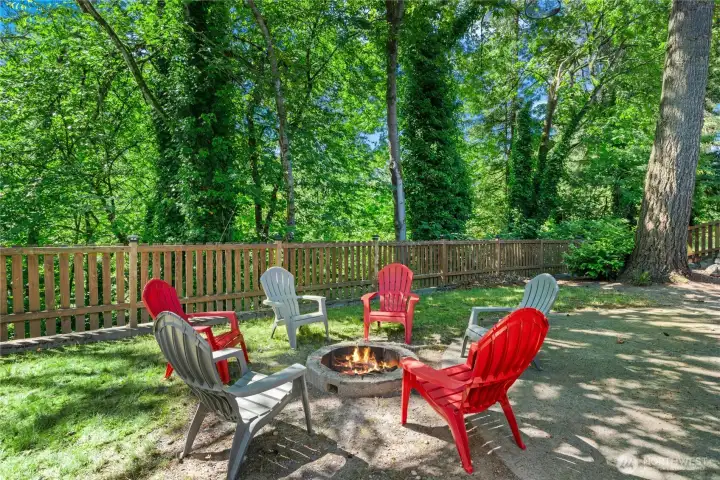 Backyard gathering space perfect for summer evenings around the fire pit. Backyard gathering space perfect for summer evenings around the fire pit.