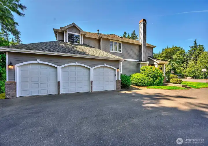 A spacious three-car garage and oversized driveway provide abundant parking for family and guests, while a storage shed and exceptional privacy complete this meticulously maintained home. A spacious three-car garage and oversized driveway provide abundant parking for family and guests, while a storage shed and exceptional privacy complete this meticulously maintained home.