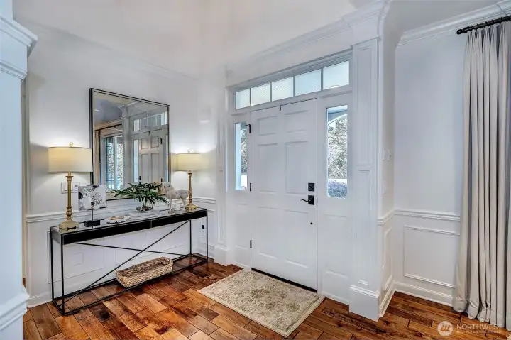 Gleaming hardwood floors and soaring vaulted ceilings create a dramatic first impression and a warm welcome home. Gleaming hardwood floors and soaring vaulted ceilings create a dramatic first impression and a warm welcome home.