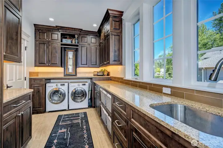 Multi-Purpose Utility Room.... More than a laundry room, this expansive space functions beautifully as a Butler's Pantry, providing generous prep space and storage for entertaining. Multi-Purpose Utility Room.... More than a laundry room, this expansive space functions beautifully as a Butler's Pantry, providing generous prep space and storage for entertaining.